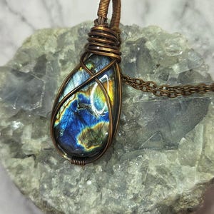 Spectrolite wrapped in aged copper