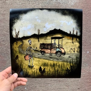 May include: A black and white illustration of two skeletons in a desert landscape. One skeleton is driving a golf cart, while the other skeleton is walking with a suitcase. The sky is a light blue with white clouds.