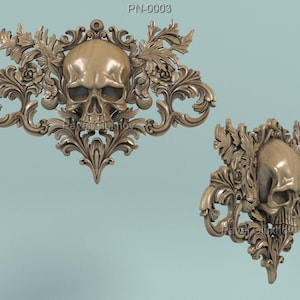 May include: Two ornate, beige-colored skull sculptures with intricate floral and scrollwork designs. The skulls are centered within the decorative frames, showcasing detailed facial features and surrounding embellishments. The text "PN-0003" is visible at the top.