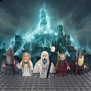 May include: Five minifigures from the Lord of the Rings franchise stand in front of a dark, ominous, and imposing fortress. The figures are Gandalf the Grey, Galadriel, Aragorn, Gimli, and Legolas. The figures are all wearing their iconic costumes and accessories.