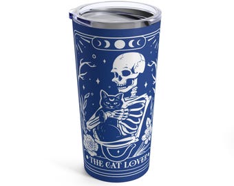 May include: A blue stainless steel tumbler with a white design of a skeleton holding a black cat. The design includes the text "The Cat Lover" and a crescent moon with three circles.