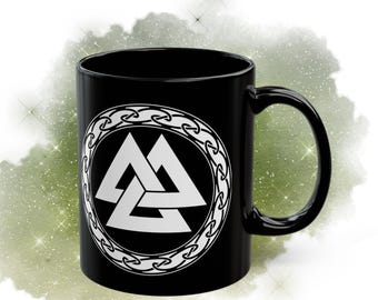 May include: Black ceramic mug with a white design of a triple triangle symbol inside a circle of chain links.