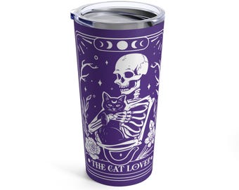 May include: A purple stainless steel tumbler with a white design of a skeleton holding a black cat. The design includes the text "The Cat Lover".