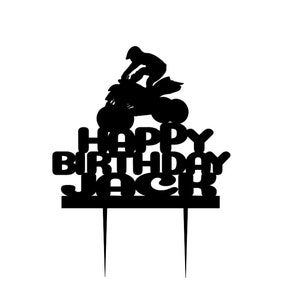 May include: Black silhouette cake topper featuring a person riding an ATV with the words "Happy Birthday Jack" underneath.