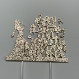 May include: Gold glitter cake topper featuring a silhouette of a person singing with the text "18 I Can't Sing With You Today My Heart Is Broken".