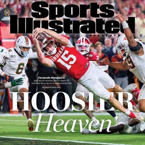 May include: Sports Illustrated cover featuring a football game. The cover shows a player in a red uniform with the number 15, diving to catch a football. The text reads "HOOSIER Heaven" and "INDIANA RULES COLLEGE FOOTBALL."