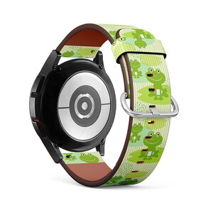 May include: A green, white and brown watch strap with a frog pattern. The strap is made of leather and has a metal buckle.