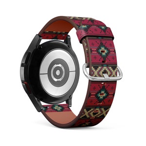 May include: A red, brown, and blue patterned leather watch band with a silver buckle. The watch band is designed with a geometric pattern.
