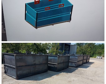 May include: A group of five black metal containers with hinged lids and handles. The containers are stacked on a concrete surface.