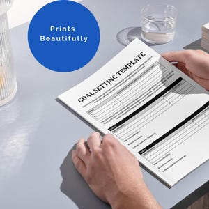 May include: A black and white goal setting template with the title "Goal Setting Template" printed at the top. The template has sections for goal details, action steps, and follow-up.