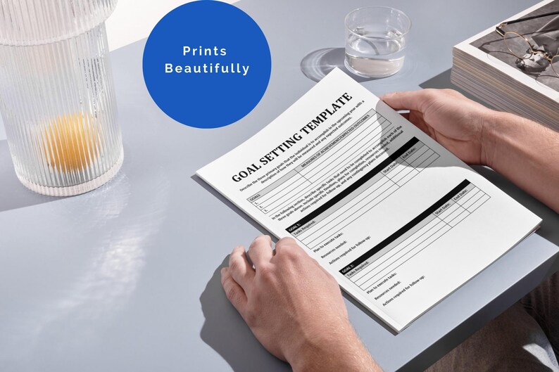 May include: A black and white goal setting template with the title "Goal Setting Template" printed at the top. The template has sections for goal details, action steps, and follow-up.