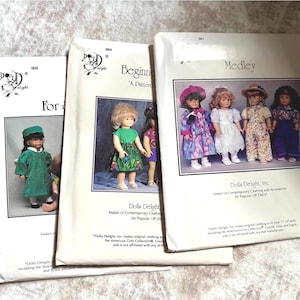 May include: Three vintage doll clothing pattern packets from Dolls Delight, Inc. The packets feature images of dolls in various outfits. The packets are labeled "For", "Beginner", and "Medley". The packets are white with black text and images.