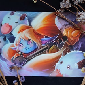 May include: A blue and purple cartoon character with long orange hair and a sword. The character is surrounded by three white fluffy creatures.
