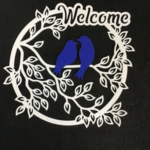 Welcome sign with lovebirds.