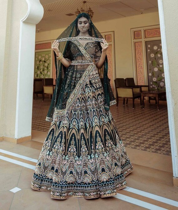 Enthralling dark rama green thread and sequins embroidered party wear  lehenga choli