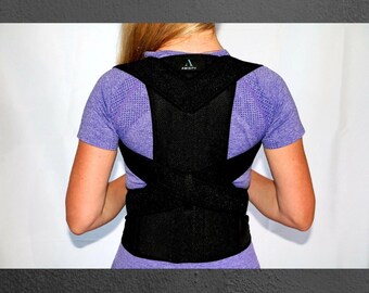 May include: A black posture corrector with adjustable straps and a mesh back panel. The text "AMITY" is printed on the back panel.