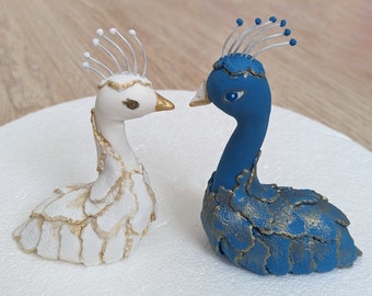 A set of two Peacocks cake toppers. No tails included, they can be ordered separately.