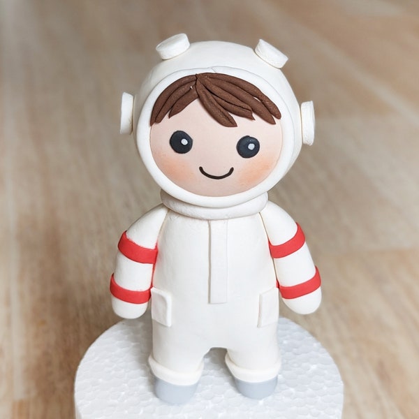 Baby Astronaut cake topper.  An edible  fondant/gum paste cake topper of astronaut child. Customizable.