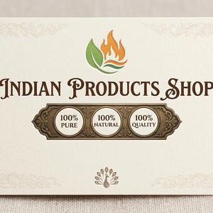 May include: A rectangular off-white card featuring the text Indian Products Shop in dark brown font. Above the text is a green leaf and orange flame logo. Below, a decorative bronze plaque contains three circles labeled 100% Pure, 100% Natural, and 100% Quality. A small peacock icon is at the bottom.