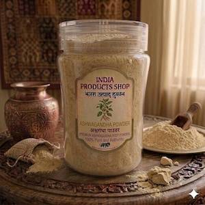May include: A clear plastic jar filled with light beige ashwagandha powder. The label reads INDIA PRODUCTS SHOP, ASHWAGANDHA POWDER, and PREMIUM ASHWAGANDHA ROOT POWDER. The jar sits on a wooden surface with a small wooden scoop and loose powder.