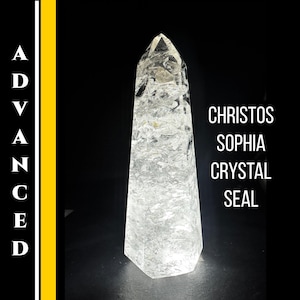 May include: A clear quartz crystal obelisk with a faceted base and pointed top. The crystal is lit from below, and the text "CHRISTOS SOPHIA CRYSTAL SEAL" is displayed on the right side. The word "ADVANCED" is displayed vertically on the left side.