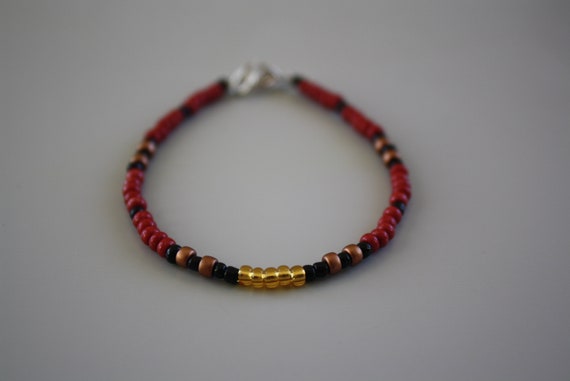 Red and black beaded best sale bracelet
