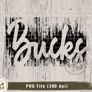 May include: A digital graphic design featuring the word "Bucks" in a white, cursive font, set against a distressed black rectangular background. The design is on a light wood grain background.