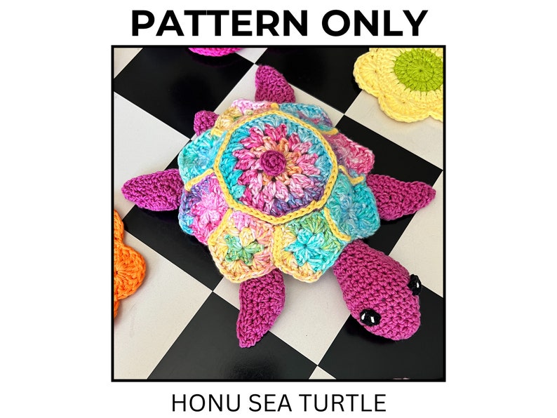 May include: A colorful crocheted sea turtle with a pink shell and a multi-colored flower pattern on its back. The turtle is sitting on a black and white checkered surface. "HONU SEA TURTLE" is written below the image.
