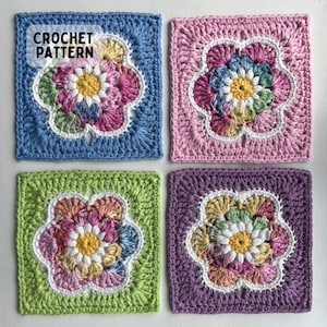 May include: Four crochet squares with flower patterns in blue, pink, green, and purple. Each square has a central flower with a white outline and multi-coloured petals. The text "CROCHET PATTERN" is visible in the upper left corner of the image.