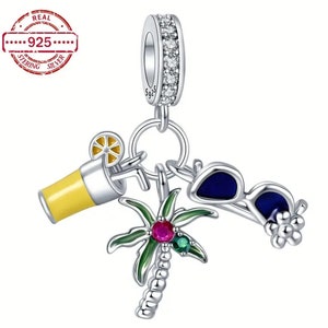 May include: Silver charm with a palm tree, sunglasses, and a glass of lemonade. The charm is decorated with colorful enamel and gemstones. The charm is marked "925" for sterling silver.