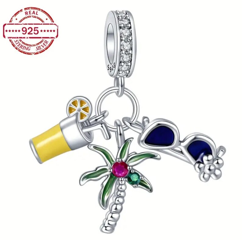 May include: Silver charm with a palm tree, sunglasses, and a glass of lemonade. The charm is decorated with colorful enamel and gemstones. The charm is marked "925" for sterling silver.