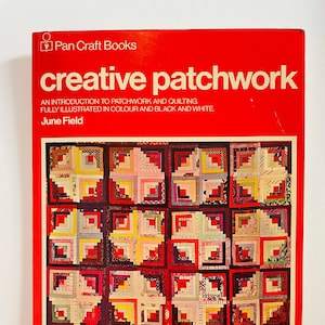 May include: A red book cover with the title "creative patchwork" and the subtitle "An introduction to patchwork and quilting. Fully illustrated in colour and black and white." The author is June Field. The cover features a colorful patchwork quilt design.