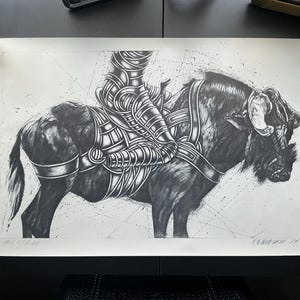 May include: Black and white illustration of a figure in armor riding a large animal, possibly a bull or bison. The artwork is detailed with geometric patterns and shading, creating a dynamic and textured image. The piece is signed in the lower right corner.