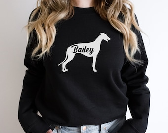 May include: Black sweatshirt featuring a white silhouette of a Greyhound dog with the name "Bailey" printed on the chest.