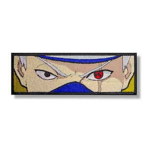 May include: Embroidered patch featuring a close-up of a character's face with a blue headband, a blue mask, and a red eye with a black swirl. The character has white hair and a serious expression.