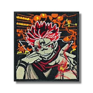 May include: Embroidered patch featuring a stylized anime character with red hair and eyes, a red scarf, and a black outfit. The character is surrounded by orange and yellow flame-like designs on a black background.