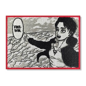 以下が含まれることがあります： 「Free Now」という文字が書かれた吹き出しを持つ、白黒のアニメキャラクターが刺繍されたパッチ。キャラクターは右手を伸ばしており、決意に満ちた表情をしている。