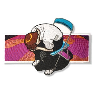 May include: Embroidered patch featuring a person sitting on a chair with their head down. The background is a pink and orange gradient with a white border.