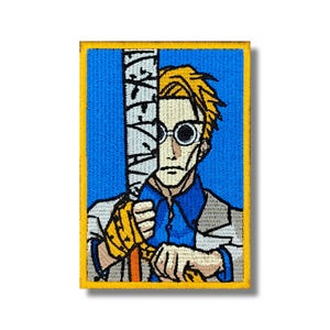 May include: Embroidered patch featuring a character with blonde hair, round glasses, and a blue shirt. The character is holding a sword-like object with text on it. The patch has a blue background and a yellow border.