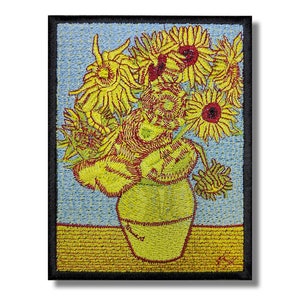 May include: Embroidered patch featuring a vase of sunflowers in a yellow and red color scheme. The sunflowers are in a yellow vase against a blue background.