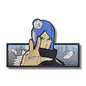 May include: An embroidered patch featuring a character from the anime series Naruto. The character has blue hair and is wearing a black and red outfit. The patch is set against a blue and white background.