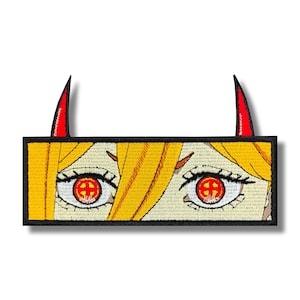 May include: Embroidered patch featuring anime-style eyes with red irises and a cross design. The patch includes yellow hair and red horns, all outlined in black. The patch is rectangular.