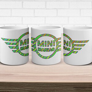 A 11oz Coffee mug with a Mini Maniac design.