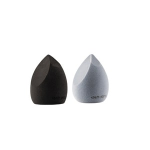 May include: Two makeup sponges, one black and one light blue, shaped like teardrops. Both sponges have the text "Beauty Lifestyle" printed on them.