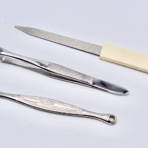 New! Set of Stainless steel nail file, eyebrow tweezer and ear spoon made in USA