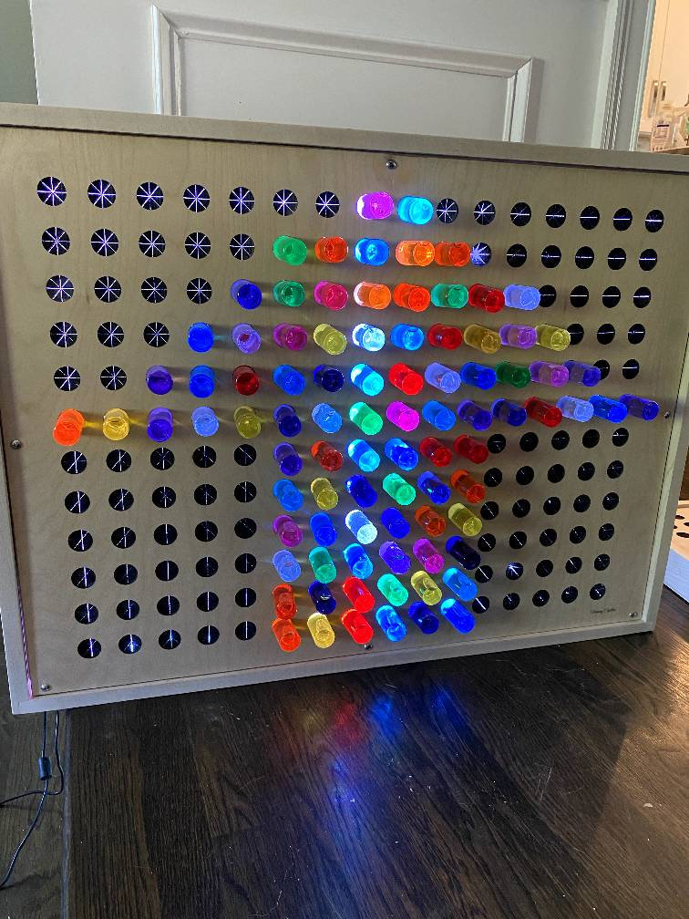 Lite-Brite lets you create art with light using design templates and bright,  colorful pegs - then lights it up like a neon sign, By Basic Fun Toys