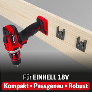 Pode incluir: Uma furadeira sem fio vermelha e preta com alça preta e corpo vermelho. A furadeira está pendurada em um suporte de parede com o texto "Für EINHELL 18V" e "Kompakt · Passgenau · Robust" abaixo.