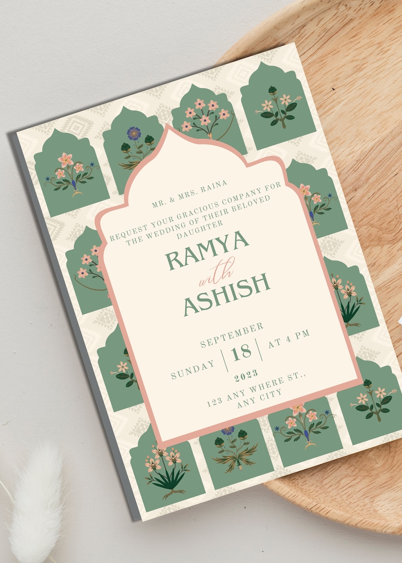 May include: A wedding invitation with a floral design. The invitation is for the wedding of Ramya and Ashish on Sunday, September 18, 2023 at 4 PM. The address is 123 Any Where St., Any City.