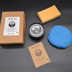 May include: A wood care set with a black tin of wood polish, a blue polishing pad, a yellow sponge, and two brown cardboard boxes with the text "Pflege-Set f&uuml;r Holzpflege" and "100%  lebensmittelechter  langanhaltender  &Ouml;l-Finish  f&uuml;r  wasserabweisend  und  nat&uuml;rlichen  Schutz  Made in Germany".
