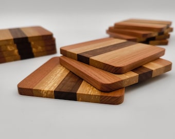 Handcrafted wooden glass coasters • Set of 4, 9 x 9 cm • Made from elm, walnut & beech • Coasters for glasses • Made in Germany